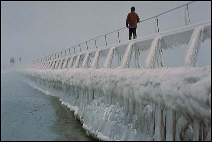 Figure on icy pier