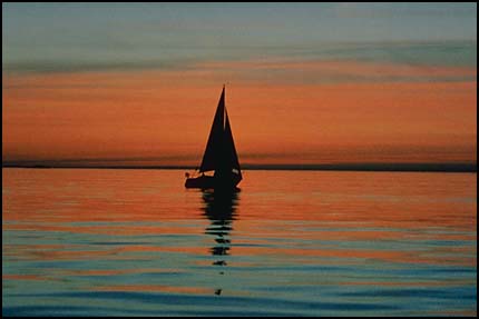 Sailboat on water-horizon middle