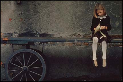 Comparison-Girl sitting on wagon