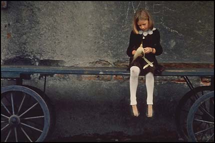 Comparison-Girl sitting on wagon