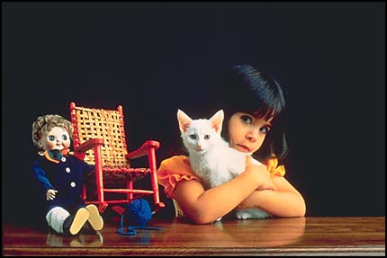 Girl hugging cat